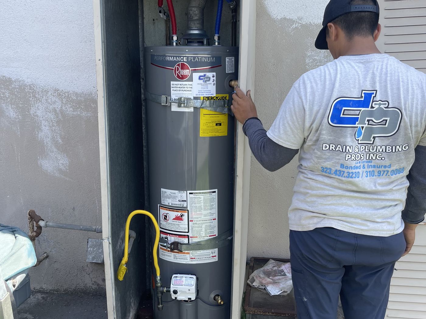 Drain & Plumbing Pros technician installing a gas water heater at a Torrance home