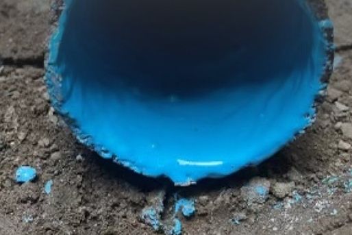 Inside of a sewer pipe after blue epoxy pipe coating, trenchless rehabilitation